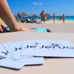 a group of cards on a table on a beach