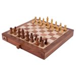 wooden chess board with wooden chess pieces and draw