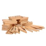 giant wooden dominoes stacked up in a pile