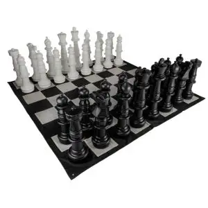 a gigantic chess board with black and white pieces