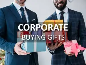 Buying Corporate Gifts With Two Men In Suits Holding Gifts